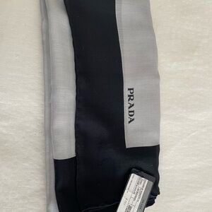 Prada scarf black and gray.                          70% virgin wool, 30% silk.